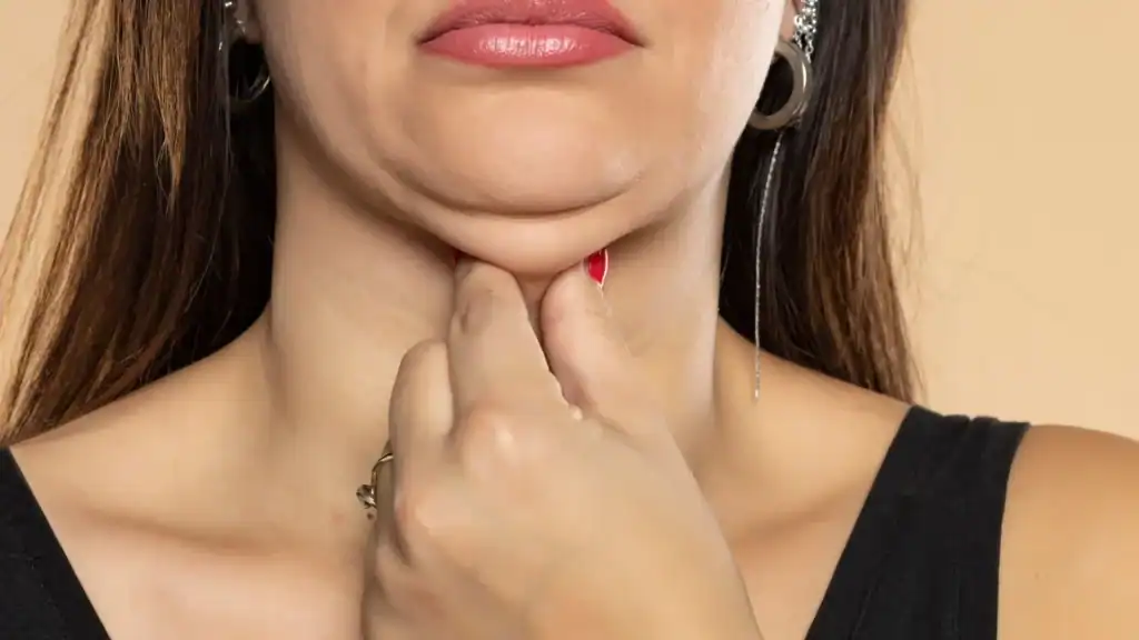 An image of a woman with double chin, sad, worried : Non Surgical Double Chin Removal Treatment in Alton, UK